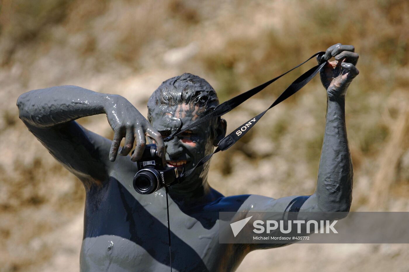 Mud bath in crater of Tizdar Volcano in Sea of Azov