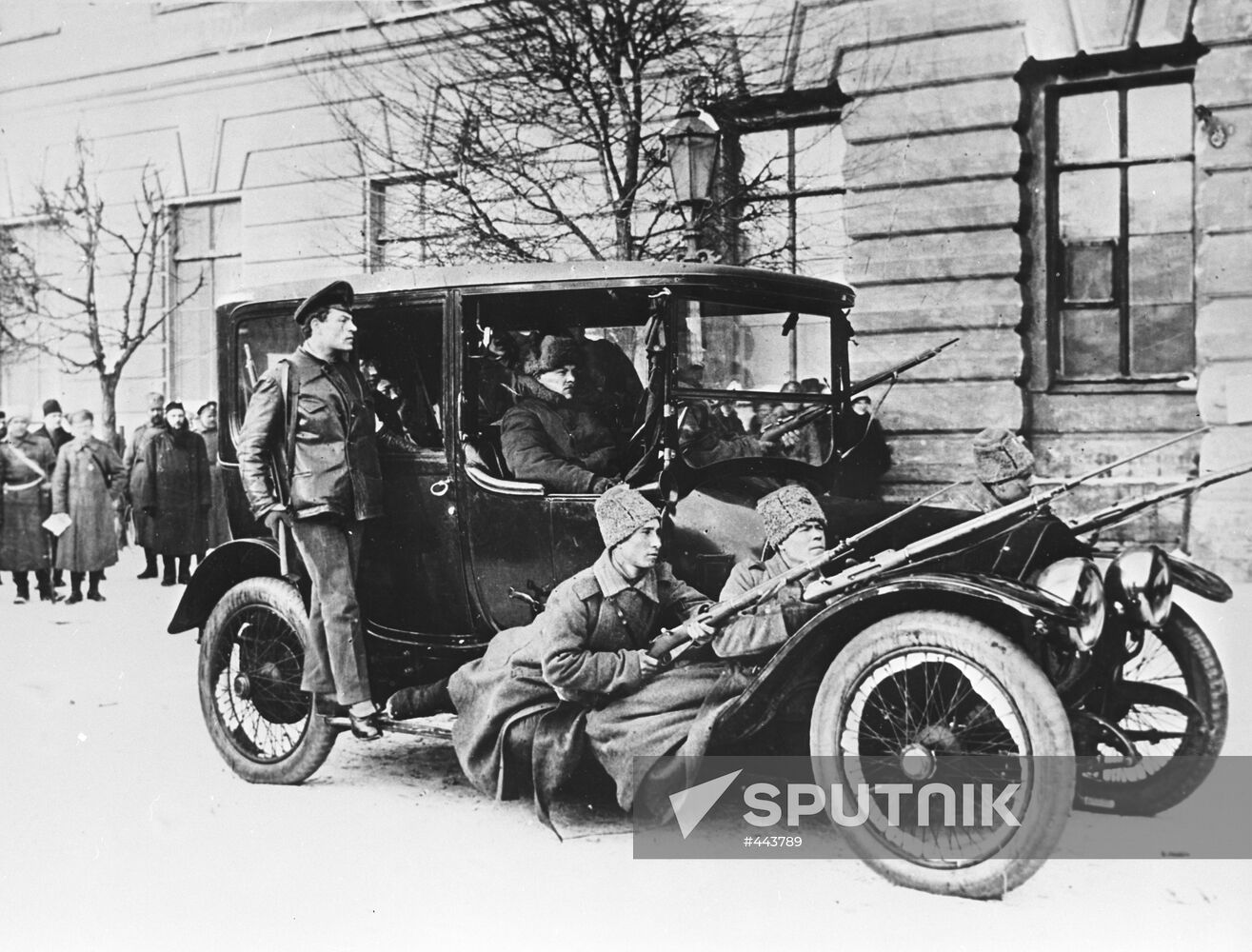 Revolutionaries in patrol car