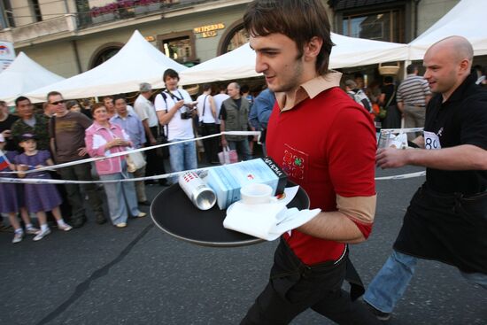 Waiters race with trays