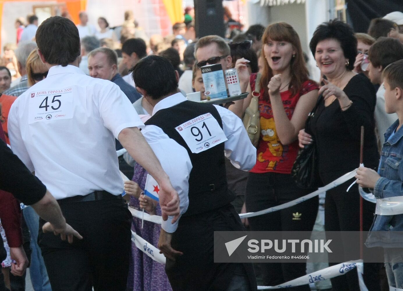 Waiters race with trays