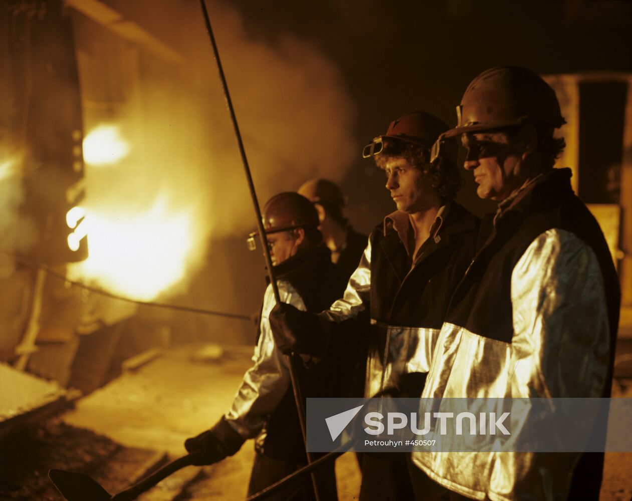 Steelworkers at an open-hearth furnace