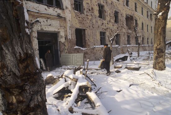 Man from Grozny is coming back into a ruined house