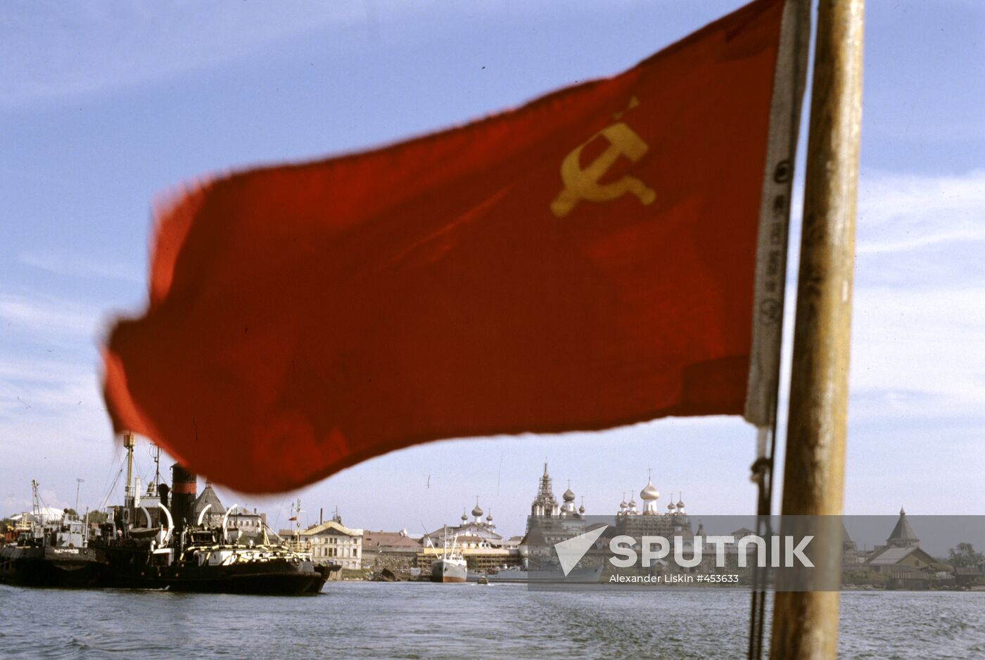 Soviet flag seen against Solovetsky Monastery