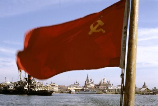 Soviet flag seen against Solovetsky Monastery