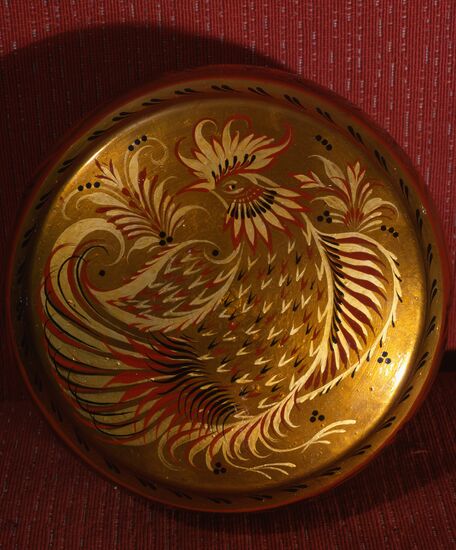 Plate with cock