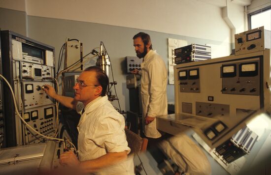 Scientists work with mass spectrometer