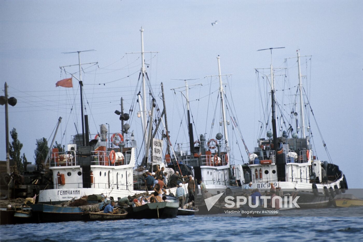 Fishermen leave the port