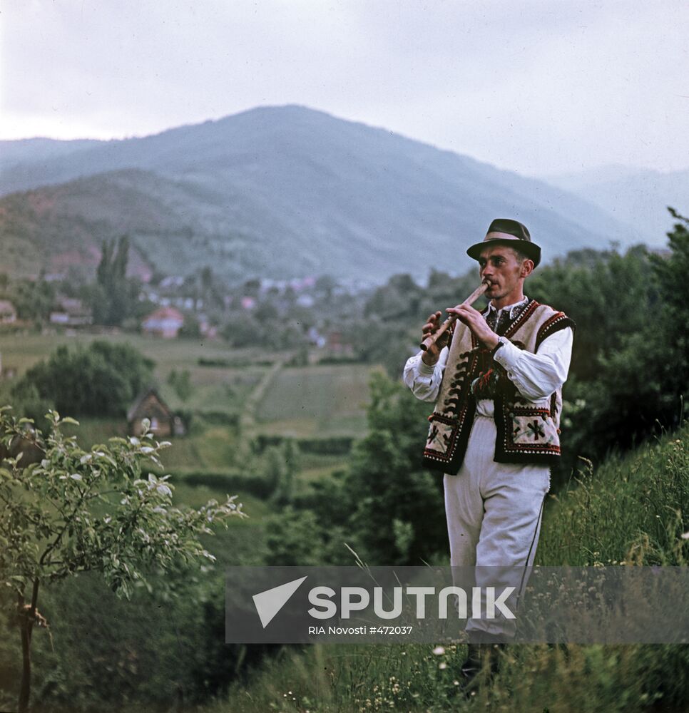 Verkhoviny resident playing reed pipe