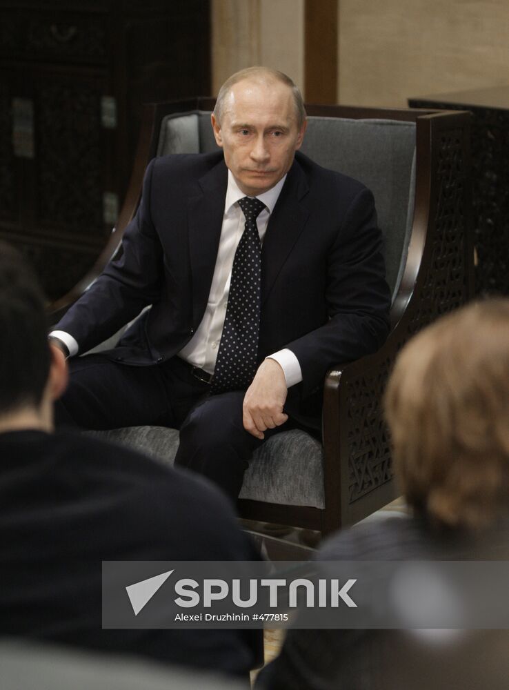 Russian Prime Minister Vladimir Putin talks to media