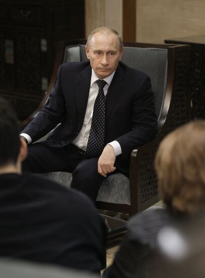 Russian Prime Minister Vladimir Putin talks to media