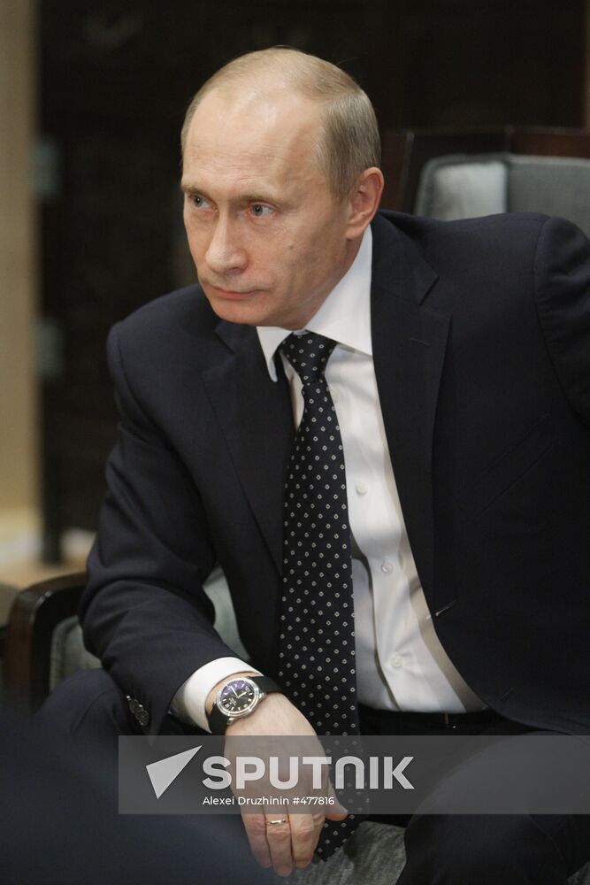 Russian Prime Minister Vladimir Putin talks to media