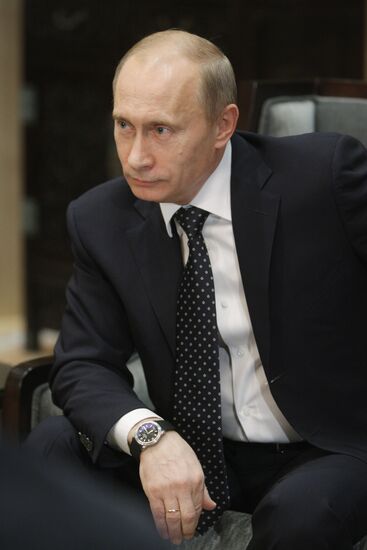 Russian Prime Minister Vladimir Putin talks to media