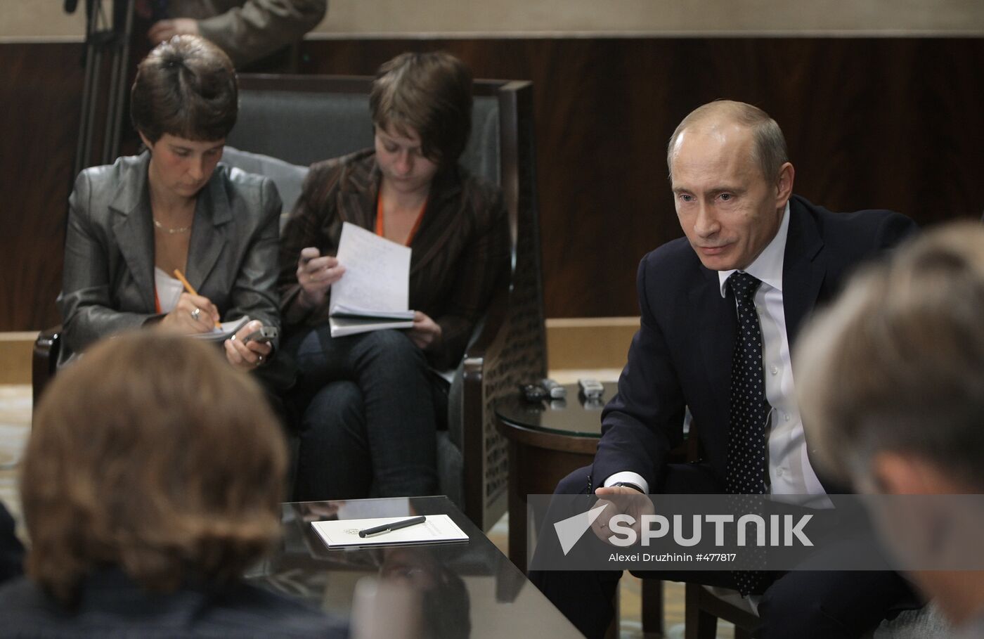 Russian Prime Minister Vladimir Putin talks to media