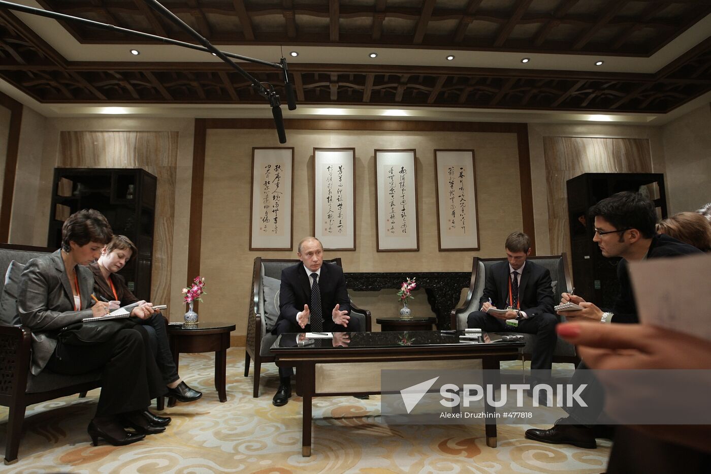 Russian Prime Minister Vladimir Putin talks to media