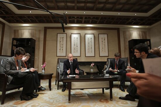 Russian Prime Minister Vladimir Putin talks to media