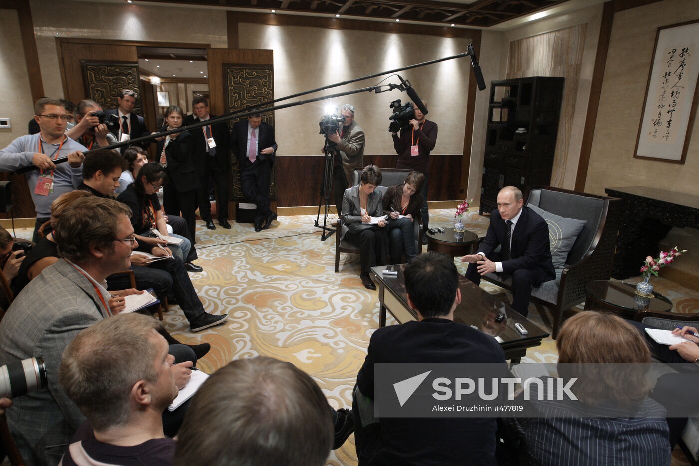 Russian Prime Minister Vladimir Putin talks to media