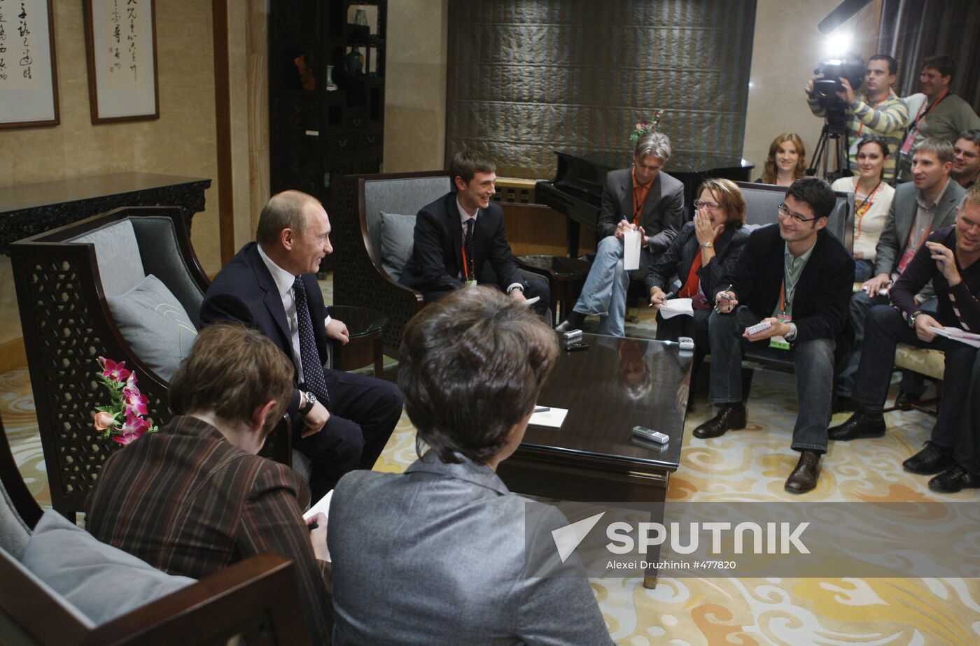 Russian Prime Minister Vladimir Putin talks to media