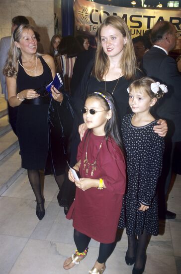 Anna Michalkova and Nadiya Michalkova with young guest