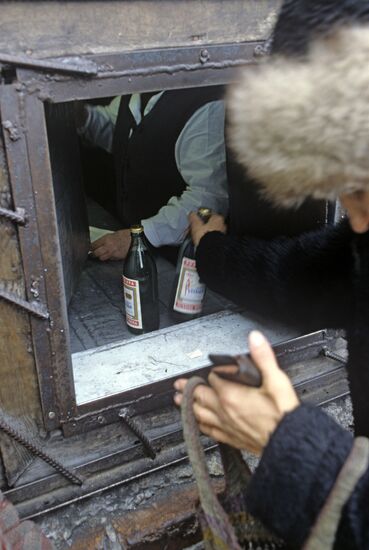 Selling vodka in miners' village