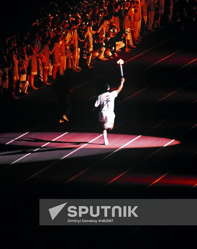 Athlete carrying Olympic flame