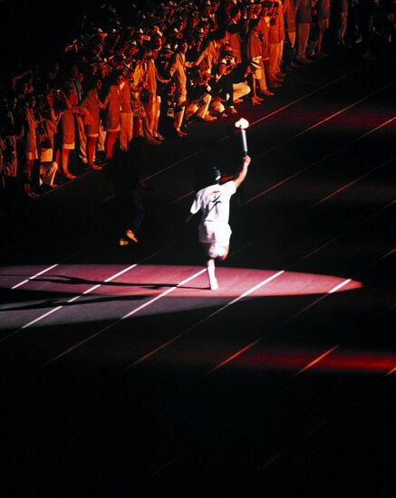 Athlete carrying Olympic flame