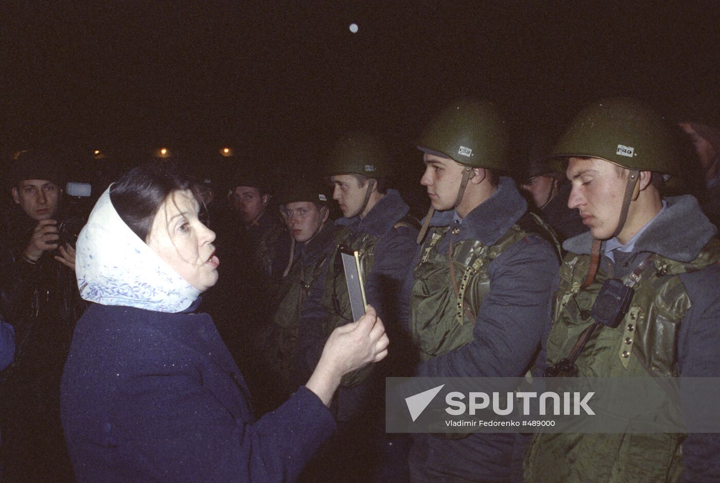 Woman talking with soldiers near Parliament House