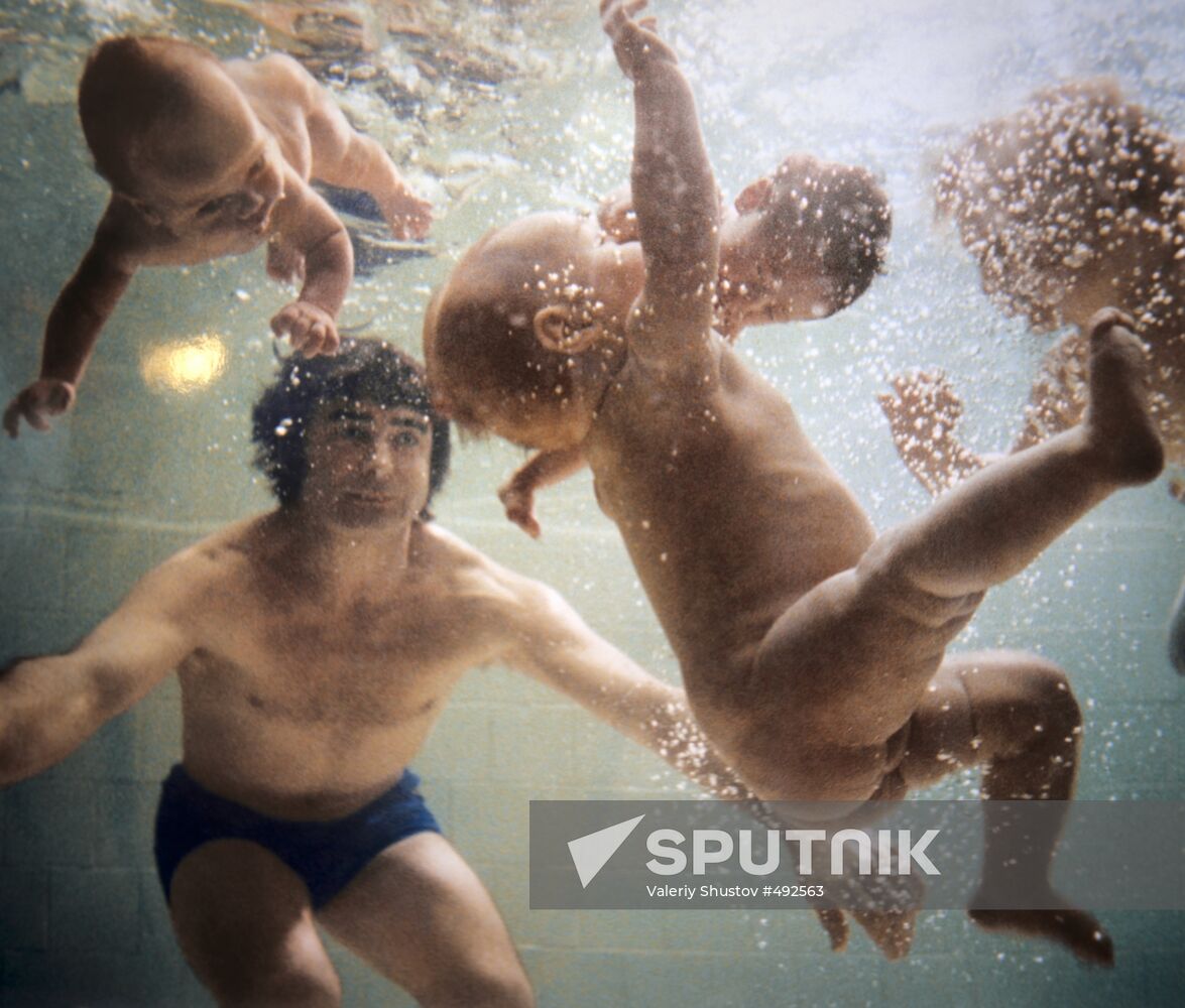 Igor Charkovsky teaching newborn babies to swim