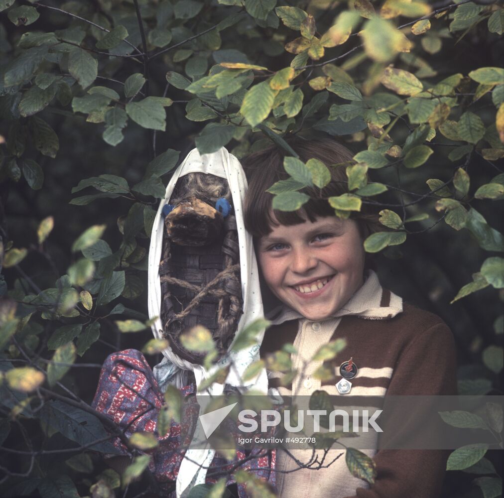 Girl with self-made doll