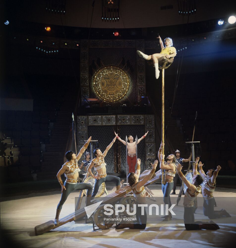 Circus artists performing acrobatic number