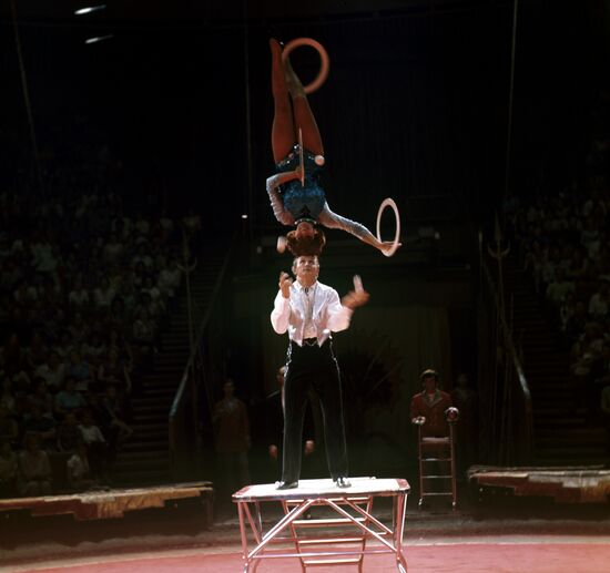 Circus artists performing equilibristic number