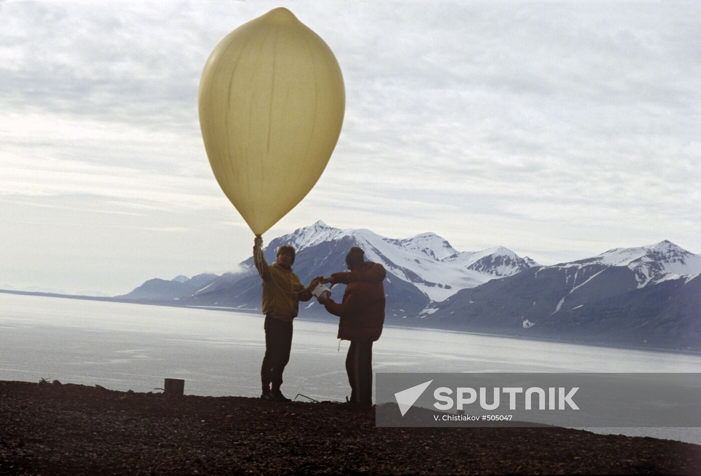 Meteorologists send a sounding balloon aloft