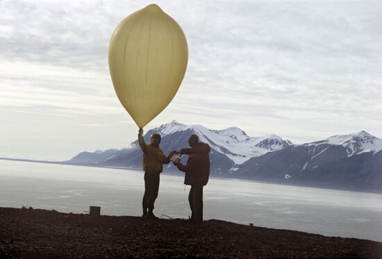 Meteorologists send a sounding balloon aloft