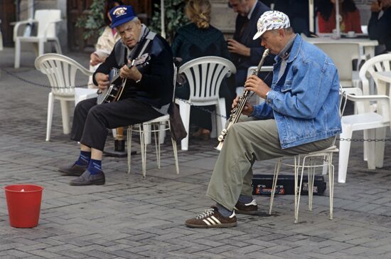 Street musicians perform at Arbat