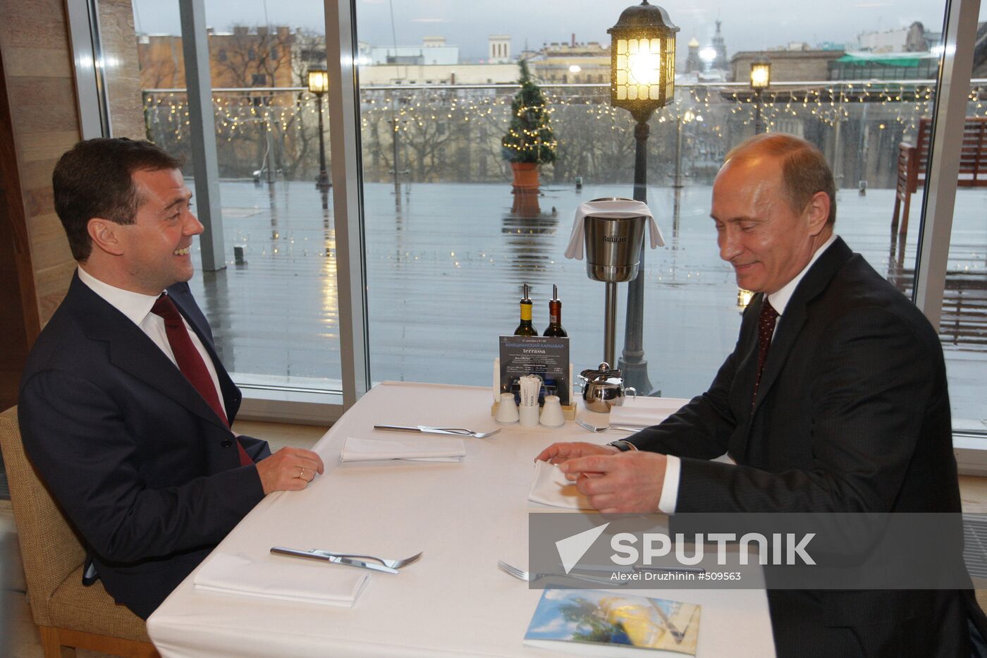 Dmitry Medvedev and Vladimir Putin at restaurant