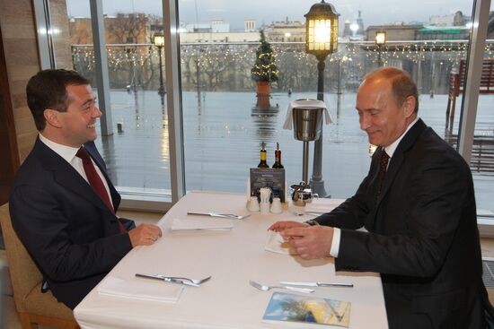 Dmitry Medvedev and Vladimir Putin at restaurant