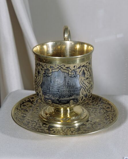 Cup with saucer