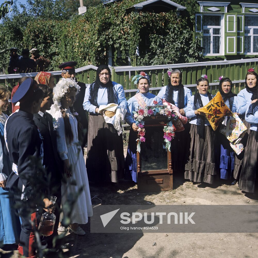 Newlyweds and fellow villagers