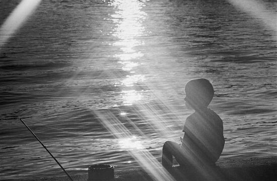 A boy out fishing