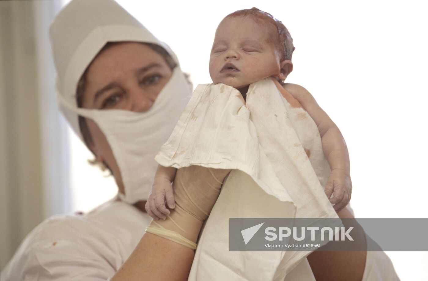 Midwife with a newborn baby