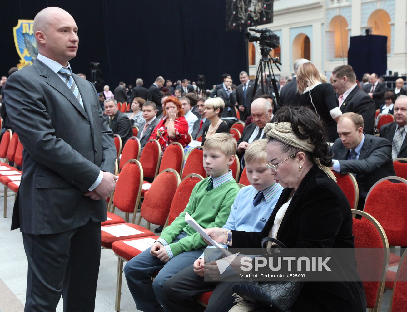 Galina Lebedeva with her grandsons, and Igor Lebedev
