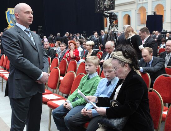 Galina Lebedeva with her grandsons, and Igor Lebedev