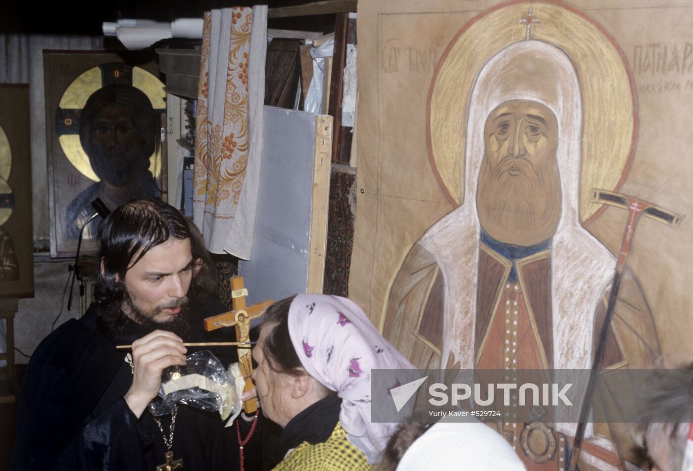 Father Ipaty is anointing with oil after liturgy