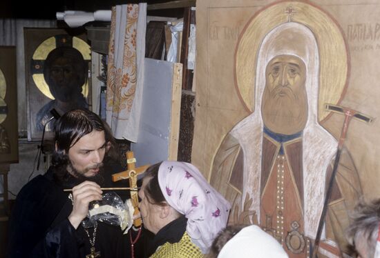 Father Ipaty is anointing with oil after liturgy