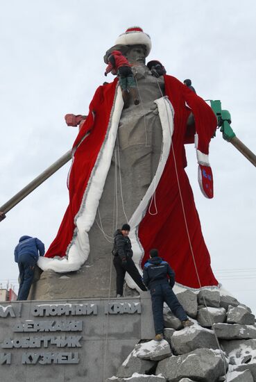 Sculpture of worker from Ural Tale dressed in Santa's costume