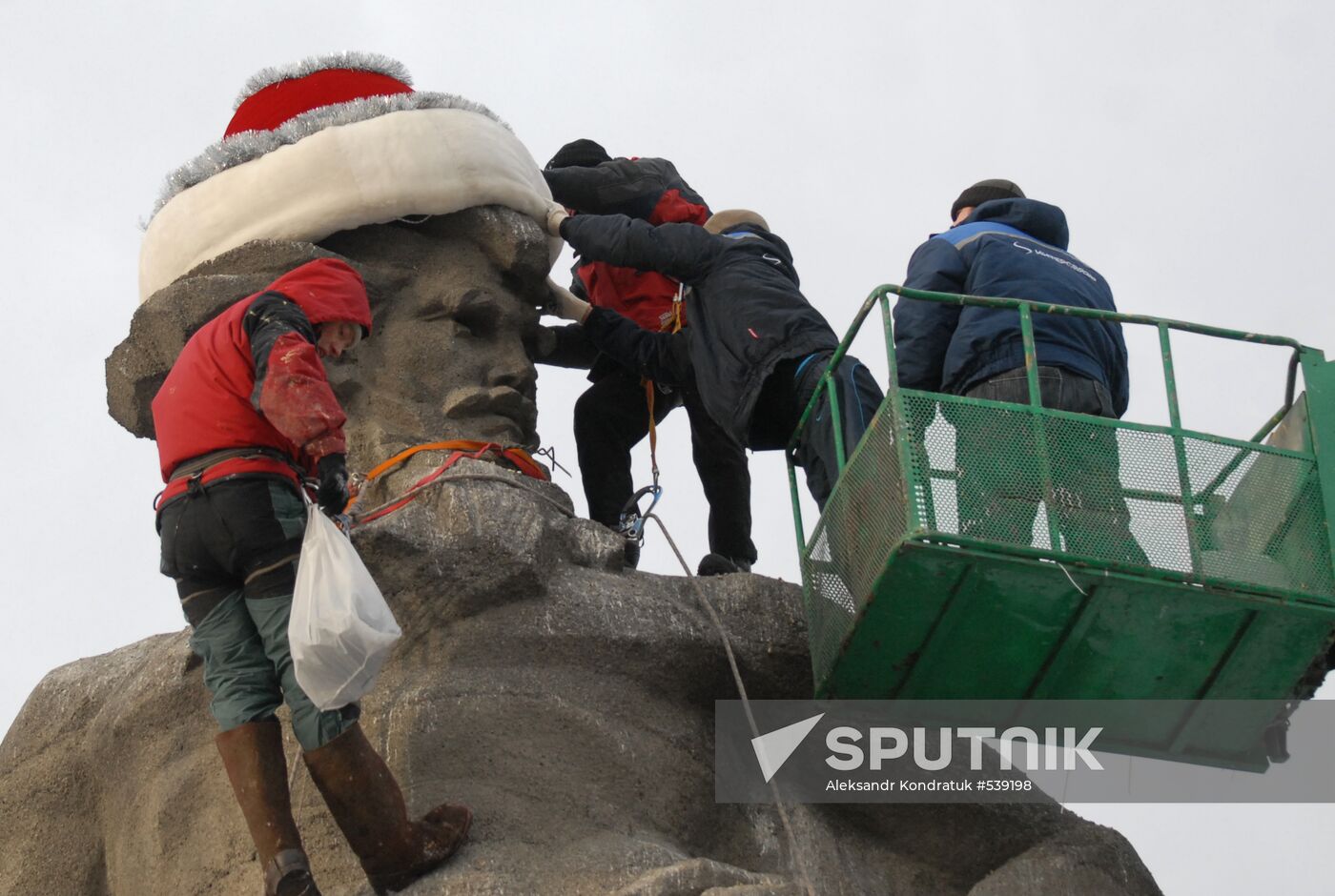 Sculpture of worker from Ural Tale dressed in Santa's costume