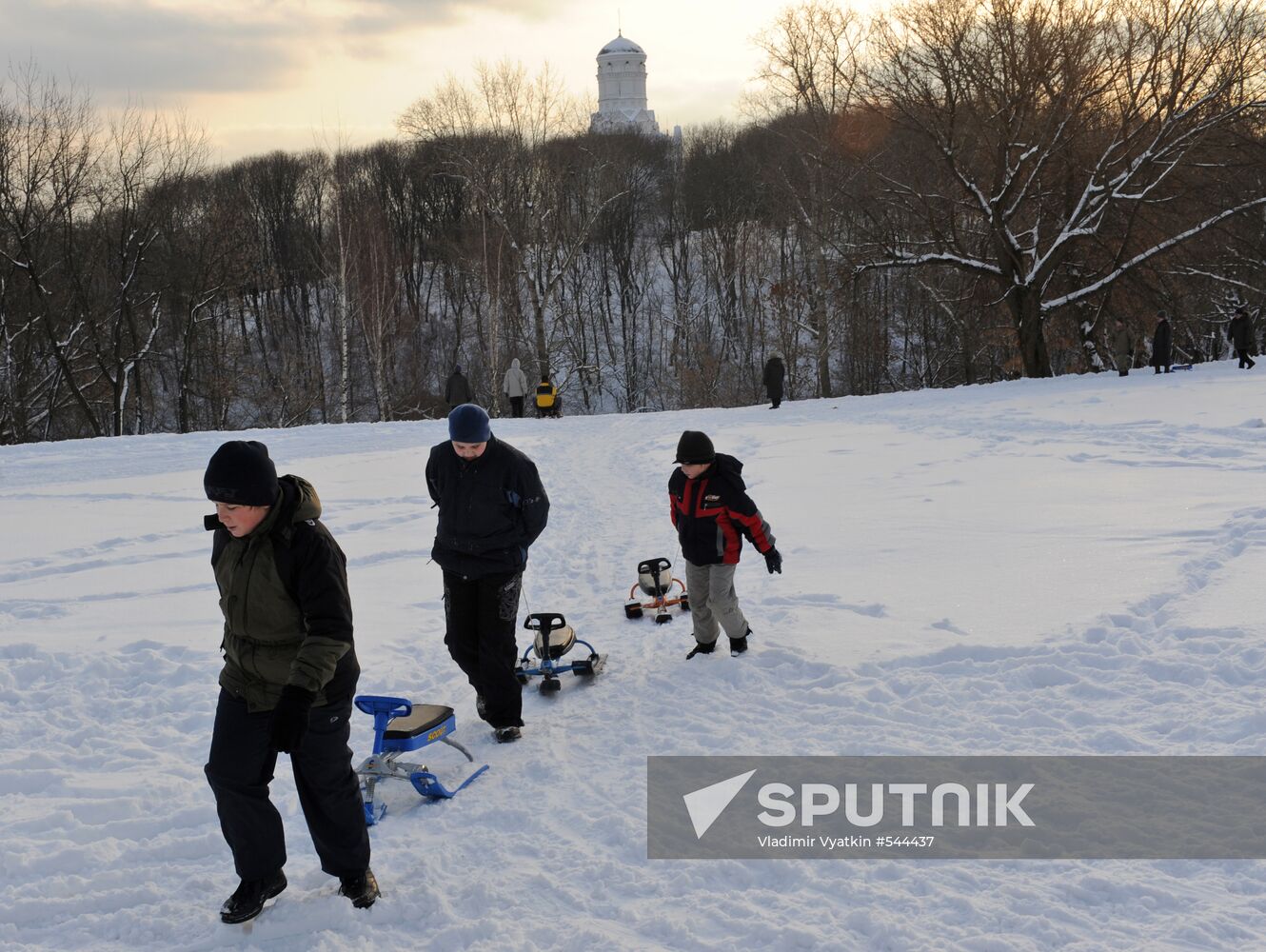 Sliding down the ice hill in Kolomenskoye