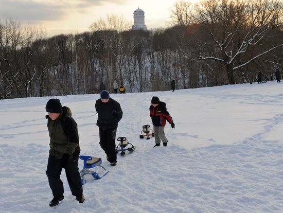 Sliding down the ice hill in Kolomenskoye
