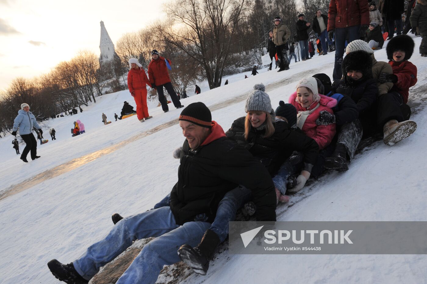 Sliding down the ice hill in Kolomenskoye
