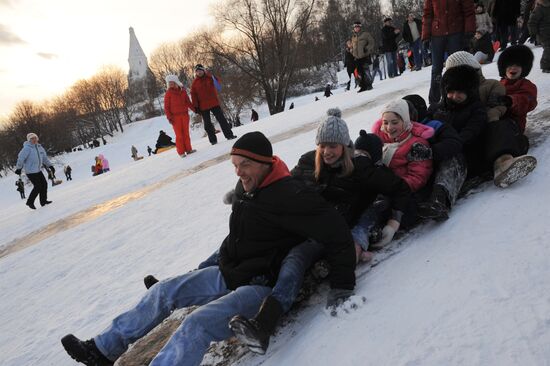 Sliding down the ice hill in Kolomenskoye