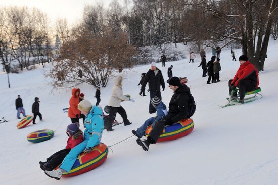 Sliding down the ice hill in Kolomenskoye